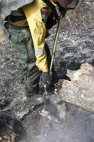 firefighter_extinguishing_ground_fire